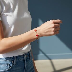 Elegant Red and Gold Clover Bracelet
